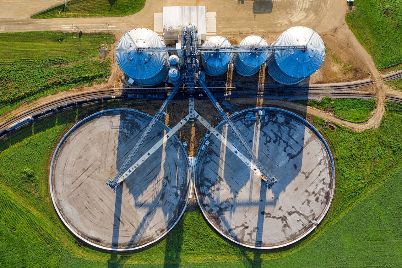 About An aerial view of industrial silos and agricultural fields in rural Randolph, Minnesota.