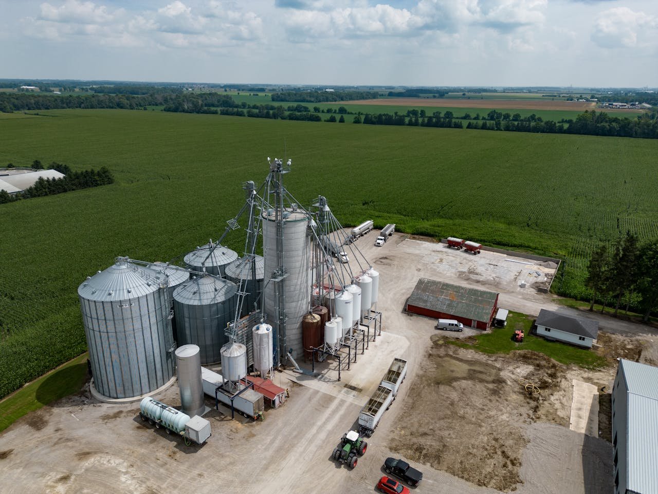 Home Drone shot capturing grain silos and vast fields in Dublin, Ontario, Canada.